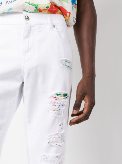 Shop Dolce & Gabbana Ripped-detail Tapered-leg Jeans In White