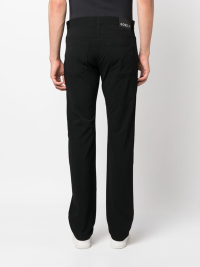 Shop Hugo Boss Mid-rise Tapered-leg Trousers In Black