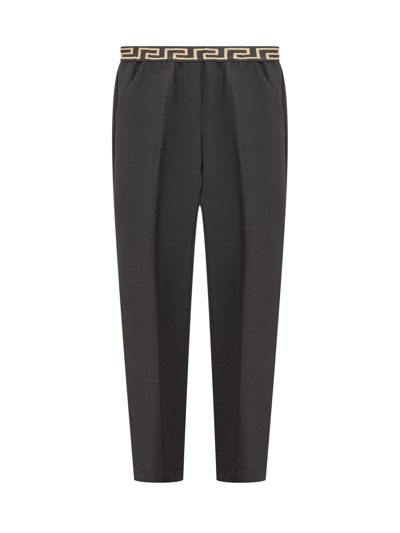 Shop Versace Greca Trousers In Black