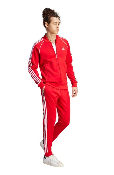 Shop Adidas Originals Lifestyle Superstar Joggers In Better Scarlet/ White