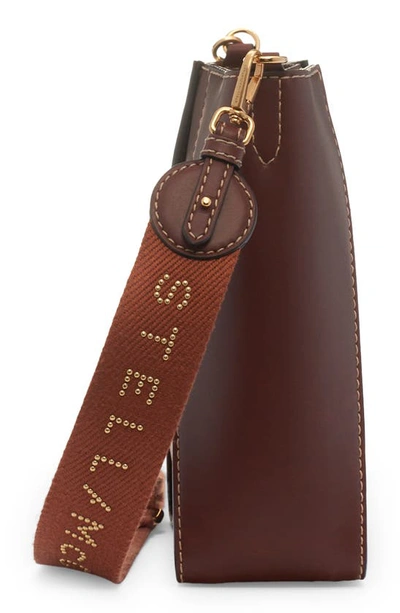 Shop Stella Mccartney Mini Circle Logo Faux Leather Crossbody Bag In Cognac
