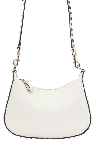 Shop Valentino Small Rockstud Leather Hobo Bag In 098 Ivory
