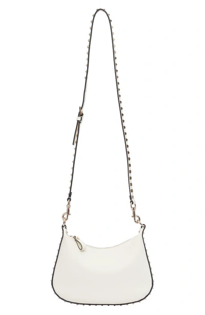 Shop Valentino Small Rockstud Leather Hobo Bag In 098 Ivory