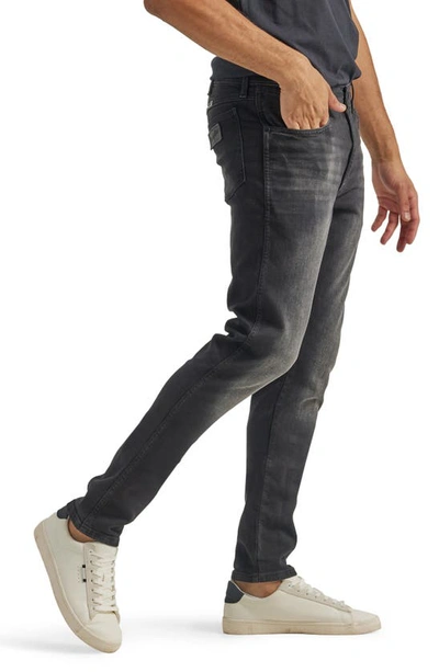 Shop Wrangler Slim Fit Jeans In Rowan