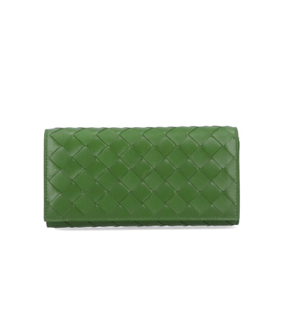 Shop Bottega Veneta Intrecciato Flap Over Wallet In Green