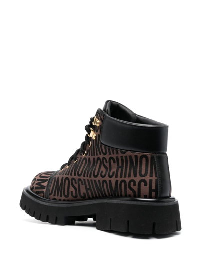 Shop Moschino Jacquard Logo Ridged-sole Boots In Brown