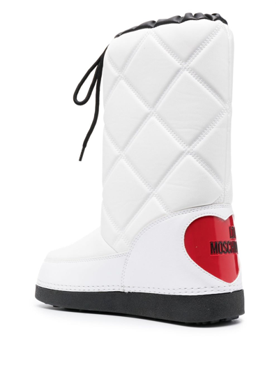 Shop Love Moschino Quilted Patent Snow Boots In White