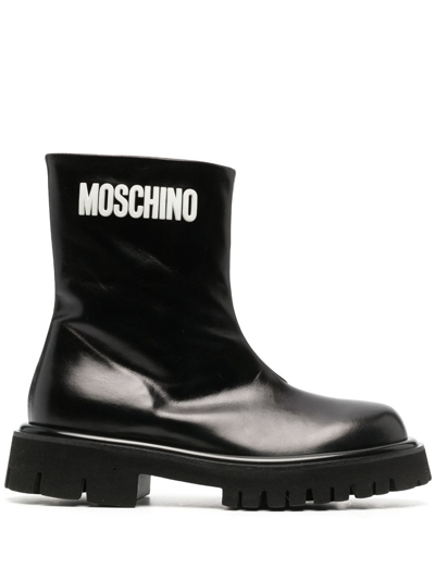 Shop Moschino Embossed-logo Zipped Leather Boots In Black