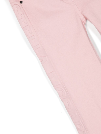 Shop Stella Mccartney Logo-appliqué Dyed Flared Jeans In Pink