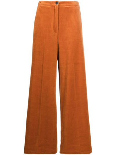 Shop Forte Forte Pressed-crease Velvet Flared Trousers In Orange