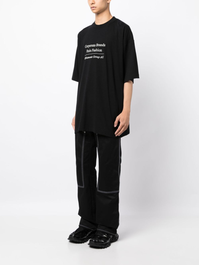 Shop Vetements Logo-print Cotton T-shirt In Black