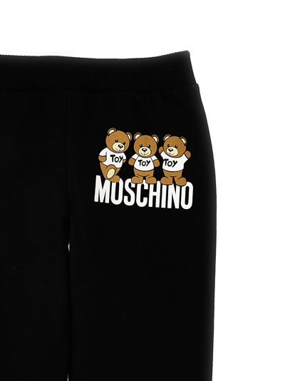 Shop Moschino Teddy Print Joggers In Black