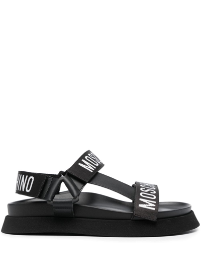 Shop Moschino Logo-strap Flat Sandals In Schwarz