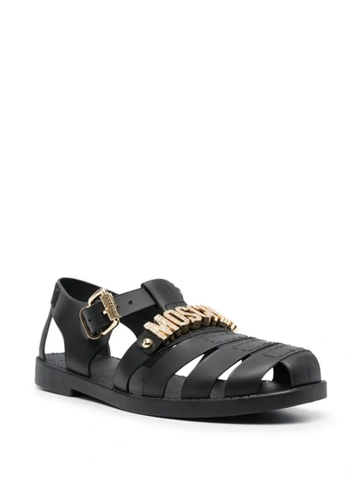 Shop Moschino Flat Sandals With Logo In Black