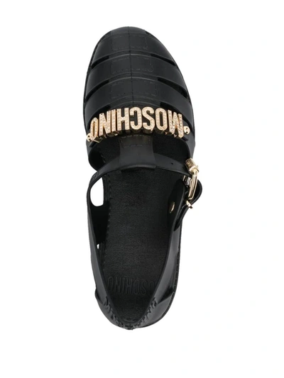 Shop Moschino Flat Sandals With Logo In Black