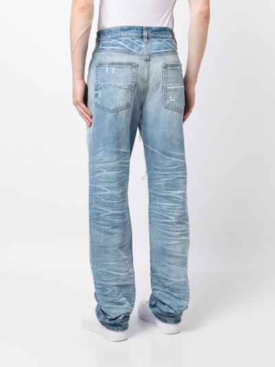 Shop Amiri Distressed Lose-fit Jeans In Blue