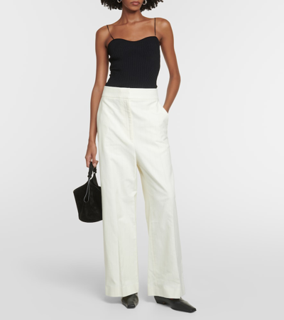 Shop Khaite Banton Low-rise Cotton Wide-leg Pants In White