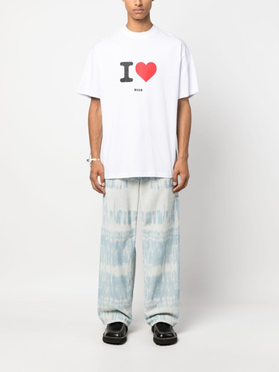 Shop Msgm Slogan-print Cotton T-shirt In White