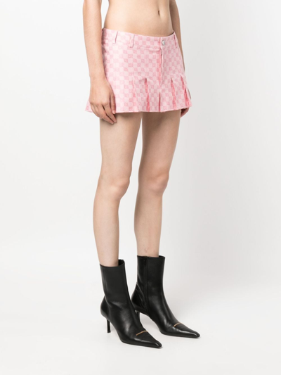 Shop Misbhv Monogram Low-rise Pleated Miniskirt In Pink