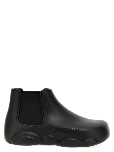Shop Moschino Gummy Ankle Boots In Black