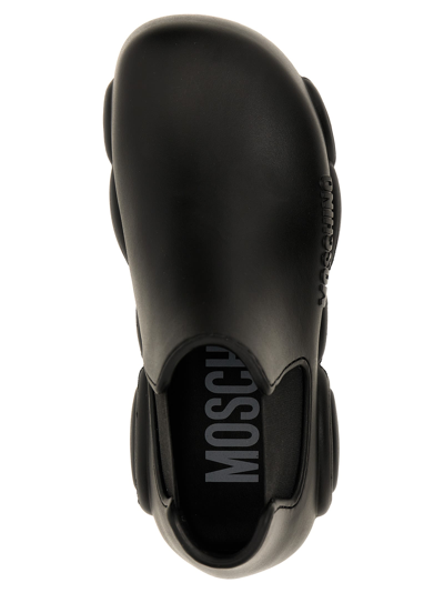 Shop Moschino Gummy Ankle Boots In Black