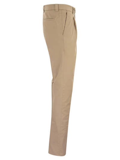 Shop Brunello Cucinelli Garment-dyed Leisure Fit Trousers In American Pima Comfort Cotton With Pleats In Sand