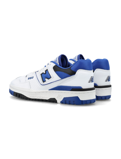 Shop New Balance 550 Low Top Sneakers In White/royal