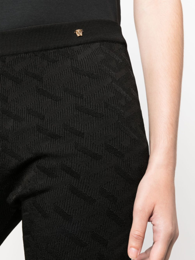 Versace Greca-jacquard Flared Trousers In Black