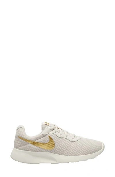 Shop Nike Tanjun Running Shoe In Phantom/ Gold/ Sail/ Volt