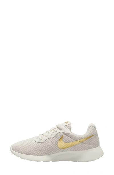 Shop Nike Tanjun Running Shoe In Phantom/ Gold/ Sail/ Volt