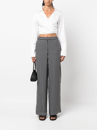 Shop Michael Michael Kors Striped Wide-leg Trousers In Black