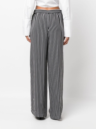 Shop Michael Michael Kors Striped Wide-leg Trousers In Black