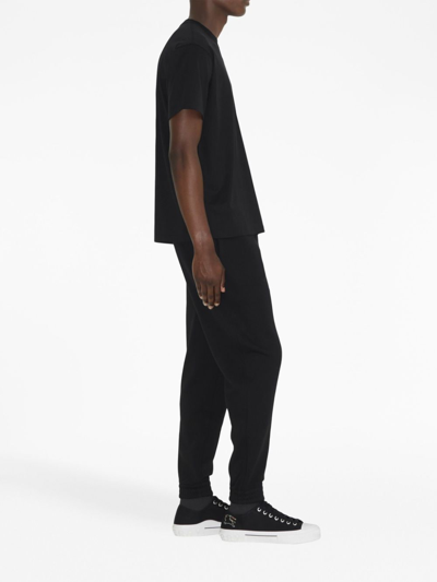 Shop Burberry Ekd-embroidery Cotton Track Pants In Schwarz