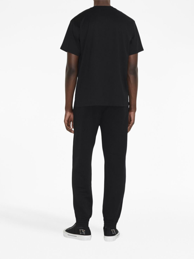 Shop Burberry Ekd-embroidery Cotton Track Pants In Schwarz