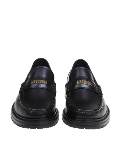 Shop Moschino Leather Loafers With Lettering Logo In Black/gold