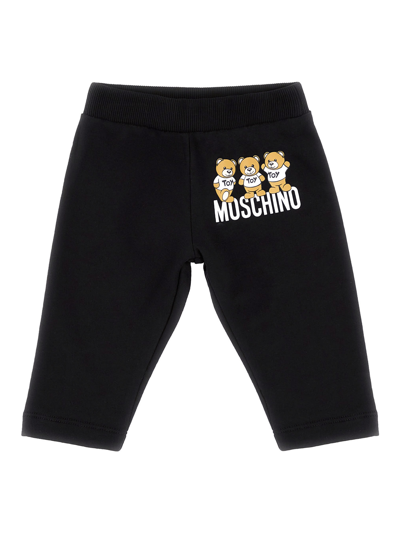 Shop Moschino Logo Trackpants In Black