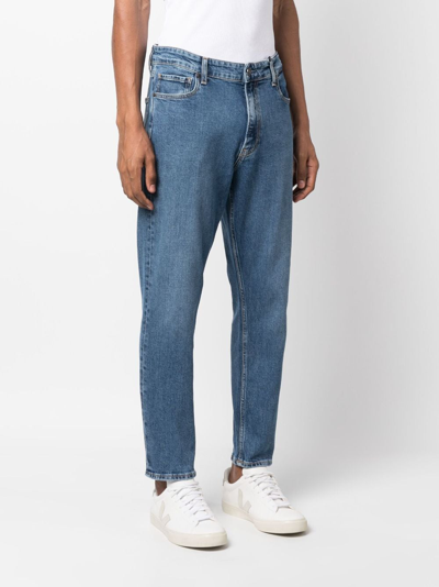 Shop Calvin Klein Logo-patch Mid-rise Tapered Jeans In Blue