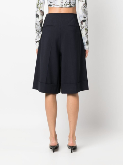 Shop Msgm Flared Pleated Shorts In Blue