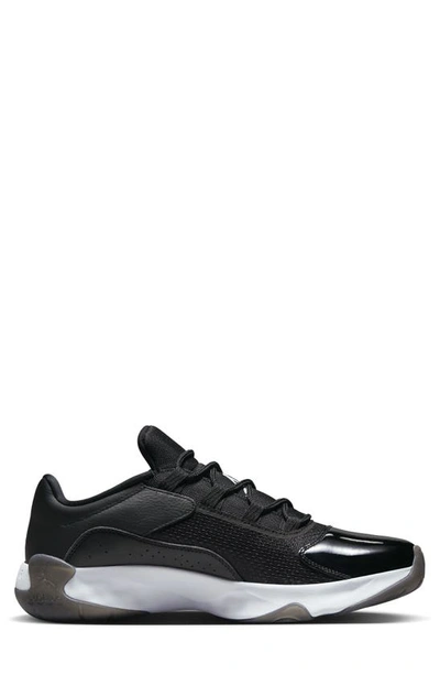 Shop Jordan Air  11 Cmft Low Sneaker In Black/ White