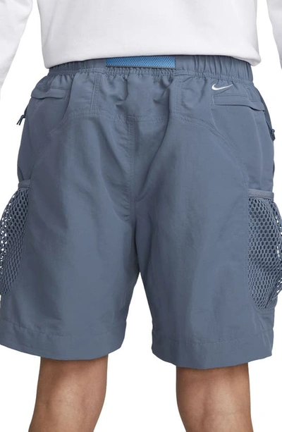 Shop Nike Snowgrass Water Repellent Nylon Cargo Shorts In Diffused Blue/ Summit White