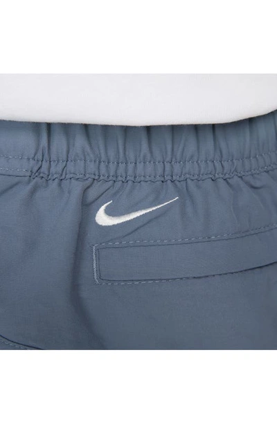 Shop Nike Snowgrass Water Repellent Nylon Cargo Shorts In Diffused Blue/ Summit White