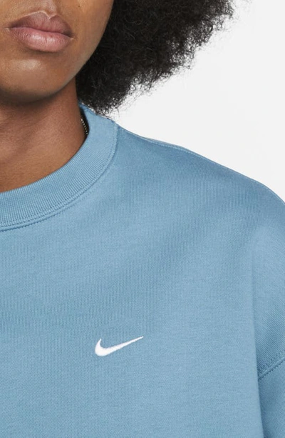 Shop Nike Solo Swoosh Oversize Crewneck Sweatshirt In Noise Aqua/ White