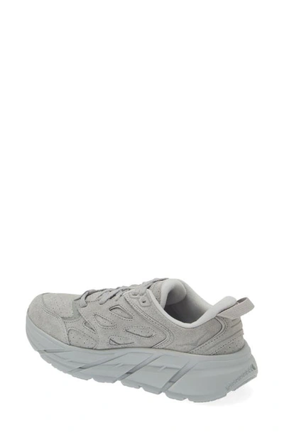 Shop Hoka Gender Inclusive Clifton L Suede Sneaker In Limestone / Limestone