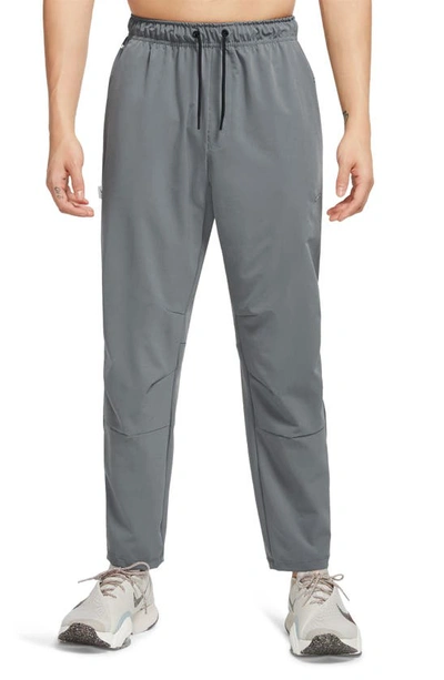 Shop Nike Dri-fit Unlimited Drawstring Pants In Smoke Grey/ Black/ Smoke Grey