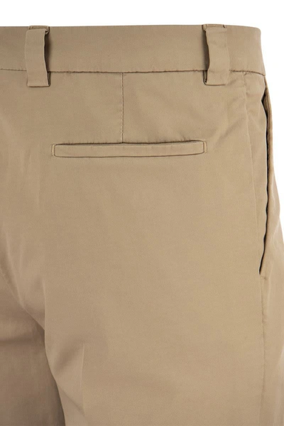 Shop Brunello Cucinelli Garment-dyed Leisure Fit Trousers In American Pima Comfort Cotton With Pleats In Sand