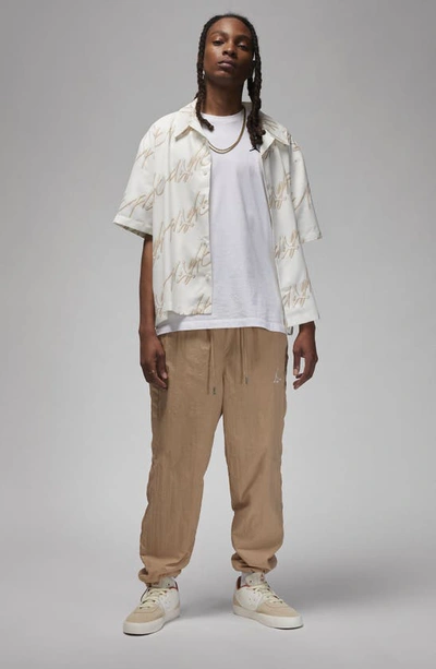 Shop Jordan Essentials Statement Warm-up Pants In Hemp/ Sail