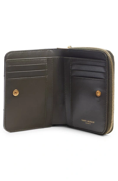 Shop Saint Laurent Cassandre Leather Compact Wallet In Light Musk