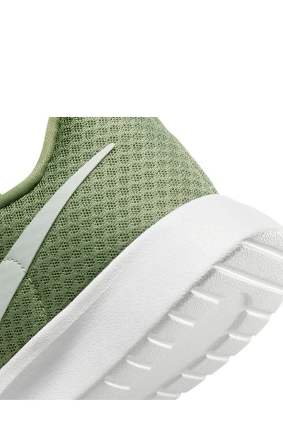 Shop Nike Tanjun Flyease Shoe In Oil Green/ Light Silver/ White