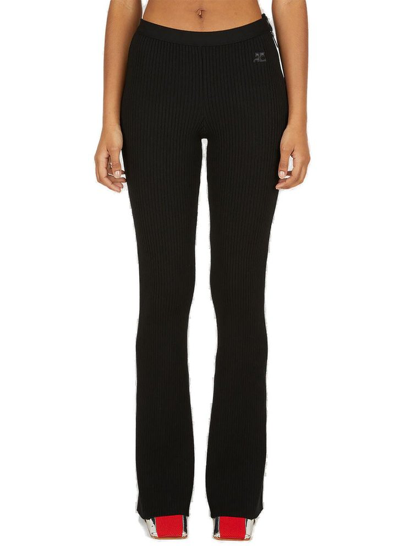 Shop Courrèges Ribbed Knit Flared Pants In Black