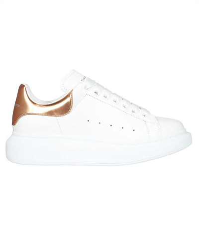 Shop Alexander Mcqueen Oversized Lace-up Sneakers In Gold